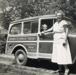 Unidentified flower shop workers before a delivery run, 1950.